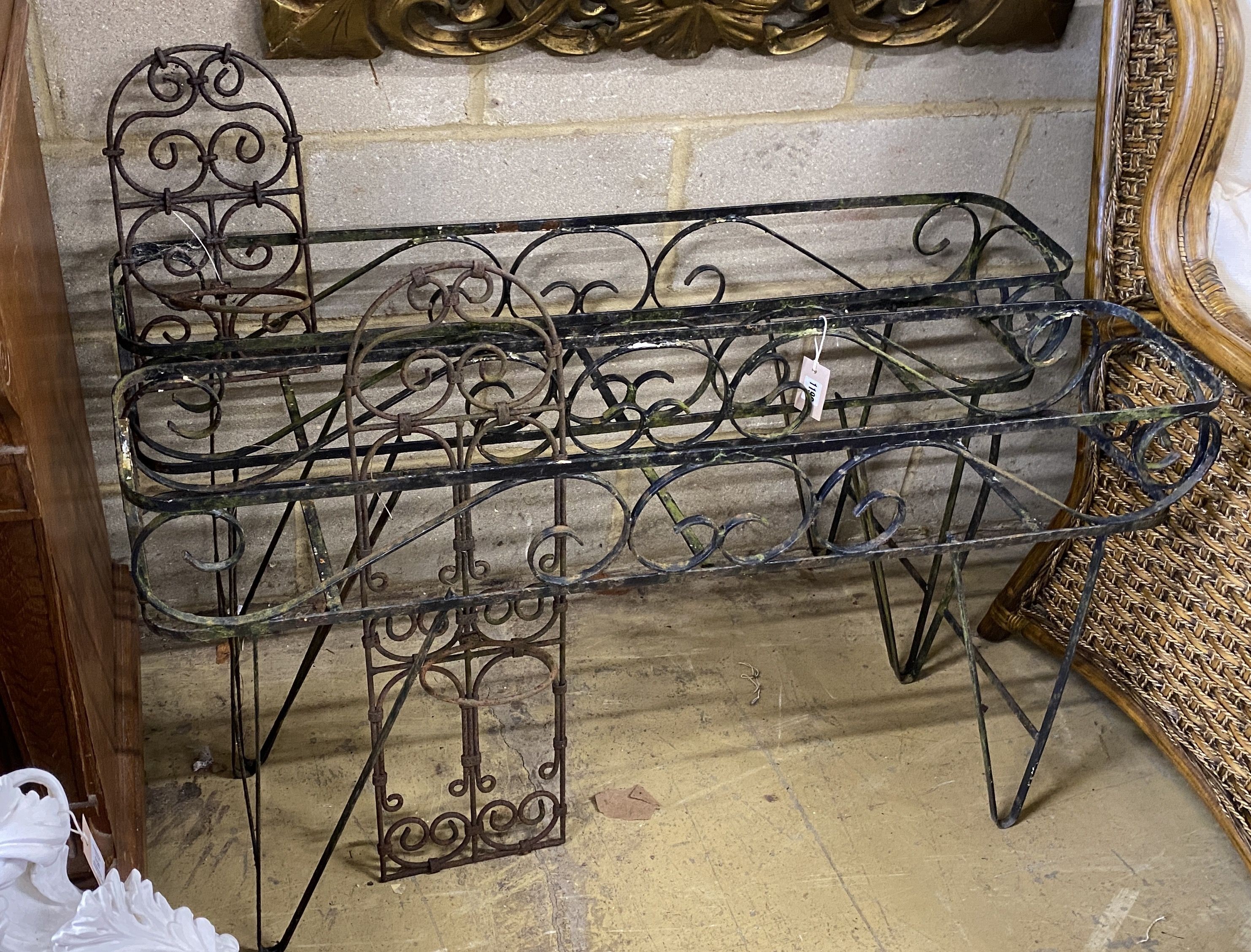 A pair of metal wrought iron pot stands, width 107cm, height 62cm together with two wrought iron wall mounted pot holders, larger height 72cm